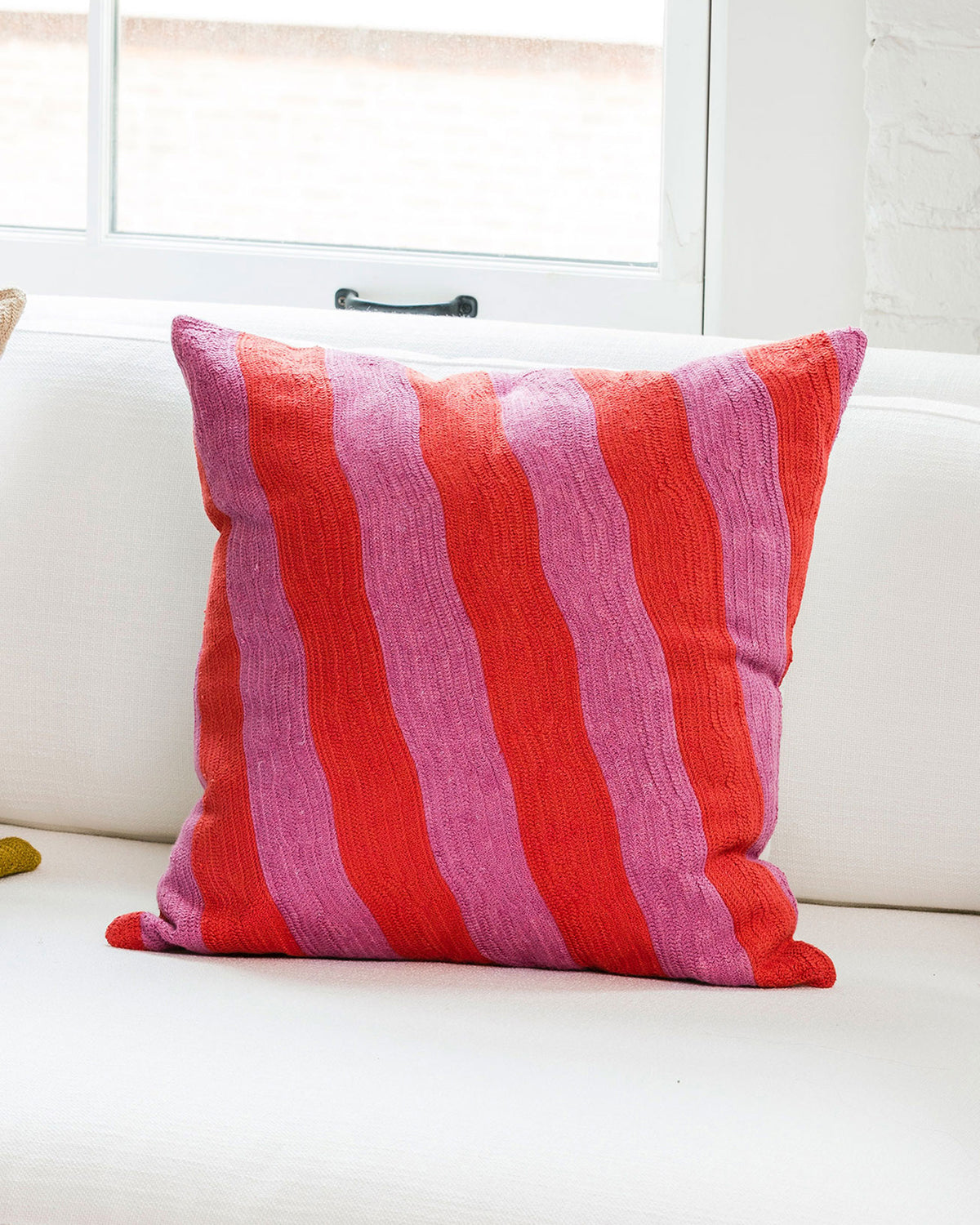 Dusen Dusen Stream Pillow. Pink tonal stripes in 100% cotton embroidery. Non-embroidered natural canvas back with a zipper opening. Made in India.