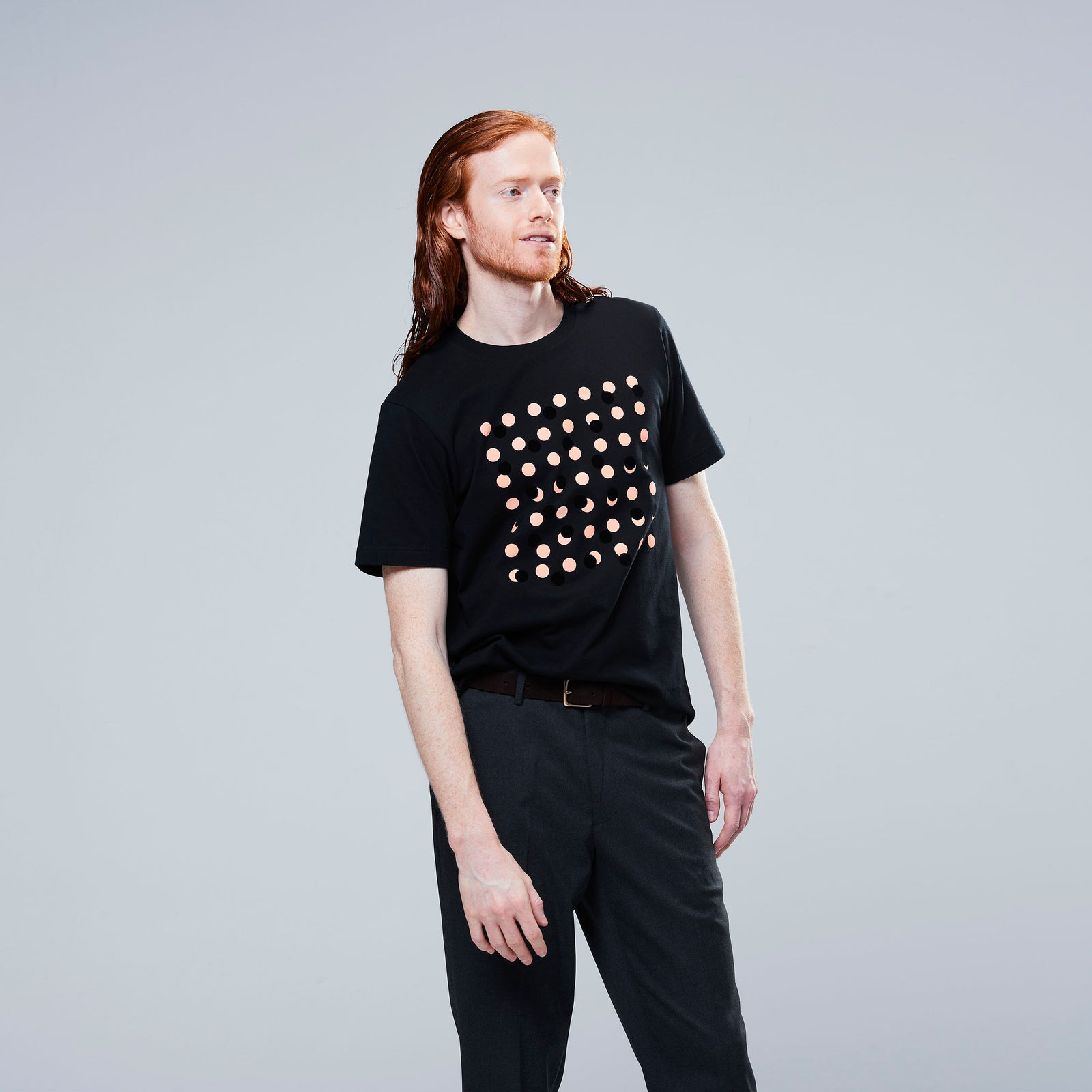 man wearing moon phase t shirt in black