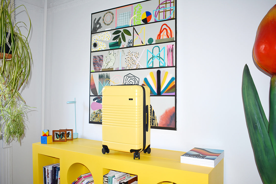 yellow suitcase on yellow console