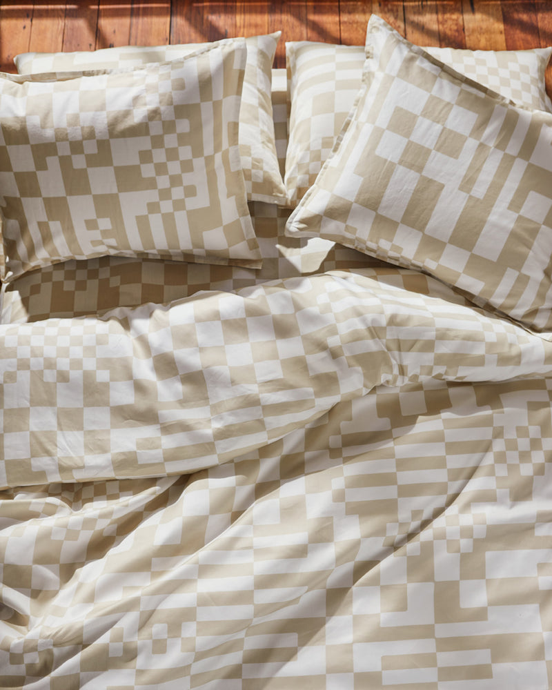 Dusen Dusen Check Duvet and Sheet Sets. Duvet and Sheet Sets in beige and white Check print. Include an individual Flat Sheet to round out a Sheet Set. 100% cotton sateen, 300 thread count. Machine wash cold and tumble dry. Made in Portugal. Our cotton sateen is smooth and cool to the touch and features a slightly lustrous finish