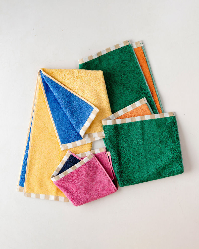 Dusen Dusen Two Tone Hand Towel Set. 100% brushed cotton terry, 700 GSM, reversible solid colorways. Hand towel: 20"x 30". Washcloth: 13"x13". Made in Portugal.
