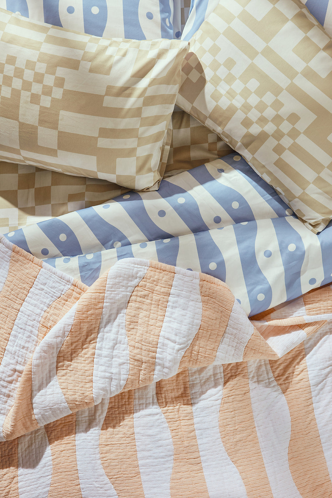 Dusen Dusen Check Duvet and Sheet Sets in beige and white Check print. Include an individual Flat Sheet to round out a Sheet Set. 100% cotton sateen, 300 thread count. Machine wash cold and tumble dry. Made in Portugal. Our cotton sateen is smooth and cool to the touch, and features a slight lustrous finish. The sateen softens further with every wash;