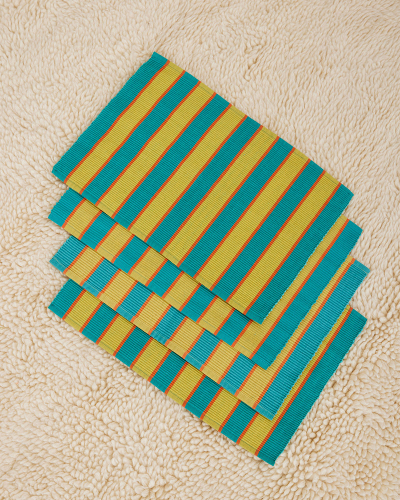Dusen Dusen Blue Parmesan Placemats Set of 4. Cotton placemats in tri-color stripes with a ribbed texture. 100% cotton, 12" x 18". Machine wash cold and lay flat to dry. Spot clean as needed. Made in India.