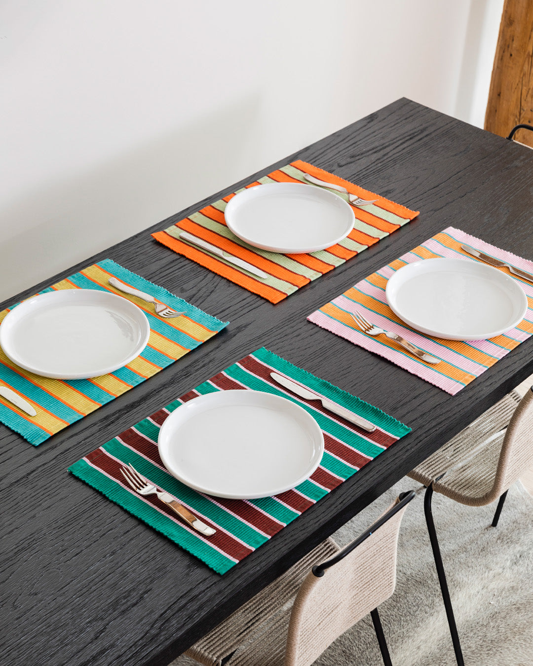 Dusen Dusen Set of Striped Placemats. Single or Set of 4 placemats in mix and match striped patterns. Cotton placemats in tri-color stripes with a ribbed texture. 100% cotton, 12" x 18". Machine wash cold and lay flat to dry. Spot clean as needed. Made in India.