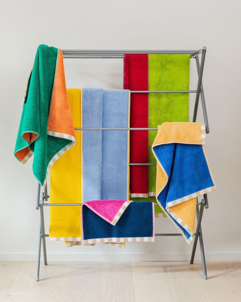 Dusen Dusen Set of Two Tone Towels. 100% brushed cotton terry, 700 GSM, reversible solid colorways. Bath towel: 30"x56". Hand towel: 20"x 30". Washcloth: 13"x13". Made in Portugal.