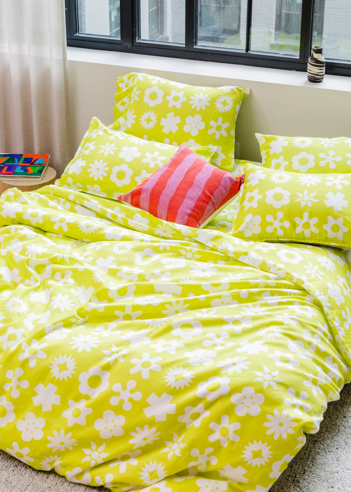 Dusen Dusen Yellow Wingding Duvet and Sheet Sets in chartreuse and white Wingdings print. Include an individual Flat Sheet to round out a Sheet Set. 100% cotton sateen, 300 thread count. Machine wash cold and tumble dry. Made in Portugal.  Our cotton sateen is smooth and cool to the touch and features a slightly lustrous finish. The sateen softens further with every wash;