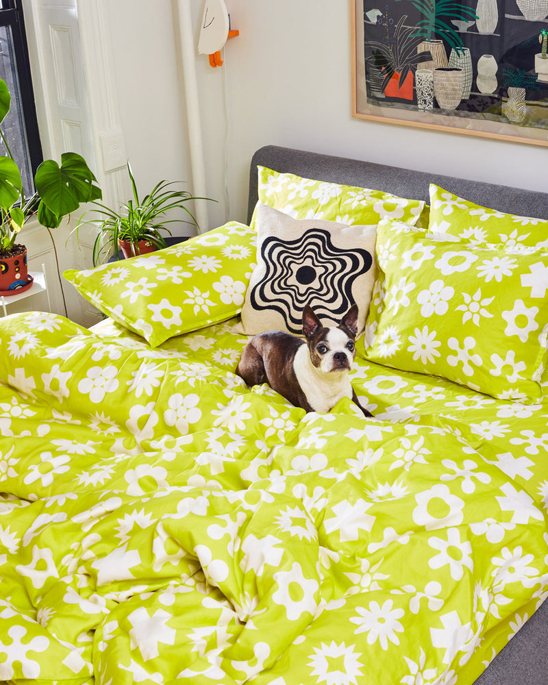 Dusen Dusen Yellow Wingding Duvet and Sheet Sets. Duvet and Sheet Sets in chartreuse and white Wingdings print. Include an individual Flat Sheet to round out a Sheet Set. 100% cotton sateen, 300 thread count. Machine wash cold and tumble dry. Made in Portugal. Our cotton sateen is smooth and cool to the touch and features a slightly lustrous finish.